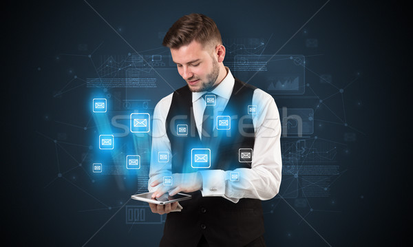 Mailing concept with businessman and tablet Stock photo © ra2studio
