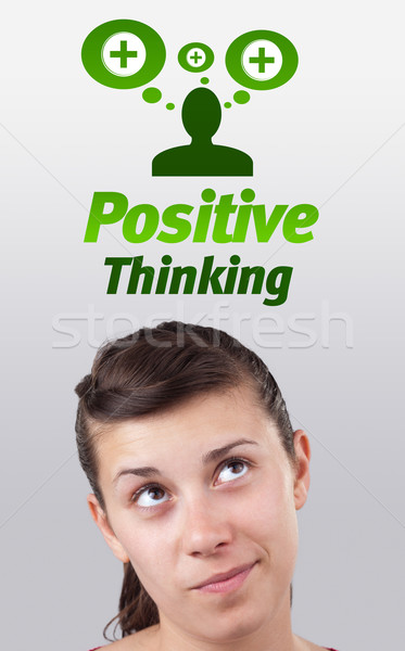 Young girl looking at positive negative signs Stock photo © ra2studio