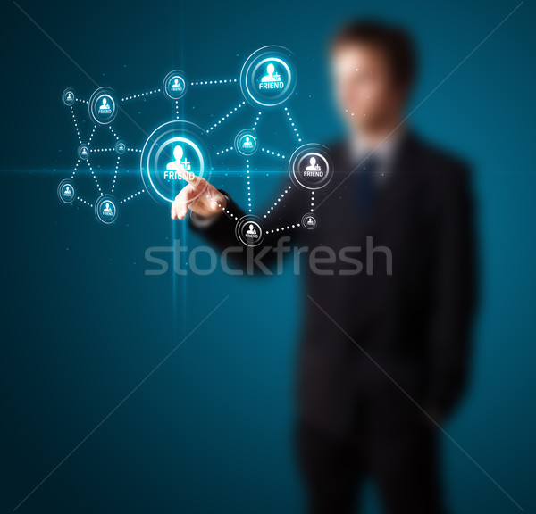 Stock photo: Businessman pressing modern social type of icons