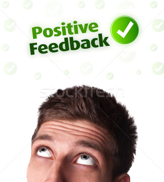 Young head looking at positive negative signs Stock photo © ra2studio