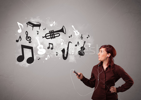 Beautiful young woman singing and listening to music with musical notes and instruments Stock photo © ra2studio