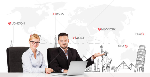 Young businessman and businesswoman with world map and major landmarks of the world Stock photo © ra2studio