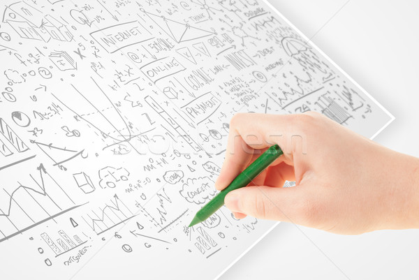 Human hand sketching ideas on a white paper Stock photo © ra2studio