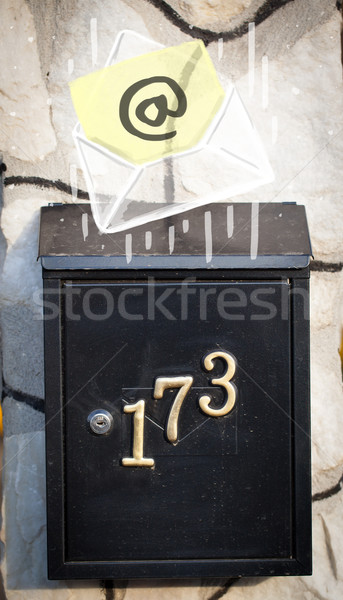 Envelope with email sign dropping into mailbox Stock photo © ra2studio