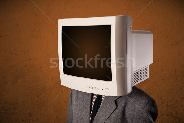 Stock photo: Business man with a monitor on his head and brown empty space