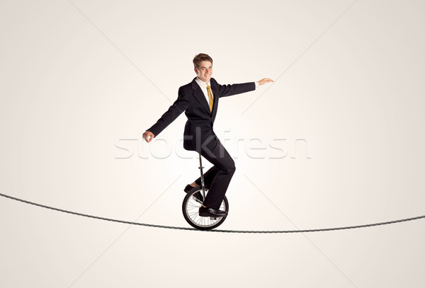 Extreme zakenman paardrijden touw man Stockfoto © ra2studio