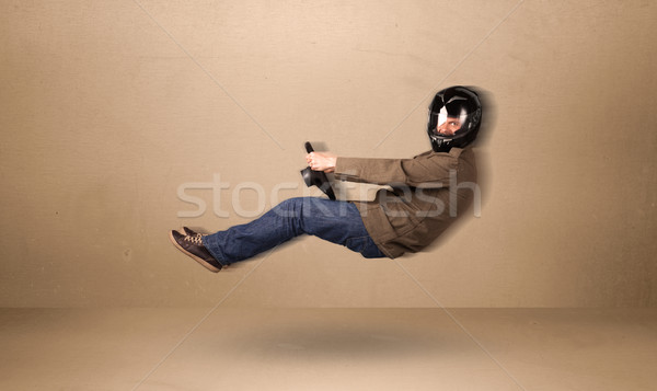 Happy funny man driving a flying car concept Stock photo © ra2studio