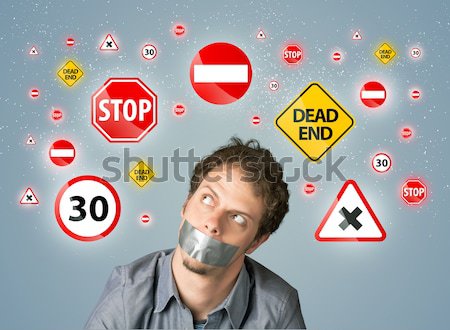 Young man with glued mouth and traffic signals Stock photo © ra2studio
