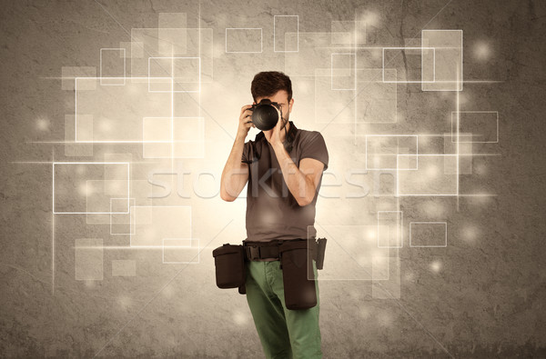 Male holdig professional camera with lens Stock photo © ra2studio