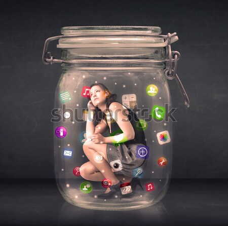 Businesswoman captured in a glass jar with colourful app icons c Stock photo © ra2studio