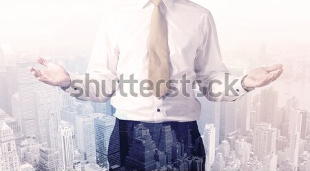 Handsome business man with overlay cityscape Stock photo © ra2studio