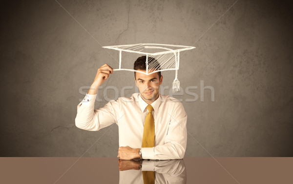 Happy college graduate drawing academic hat Stock photo © ra2studio