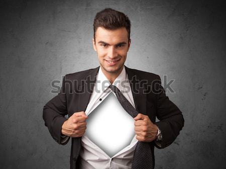 Stock photo: Businessman tearing off his shirt with white copyspace on chest