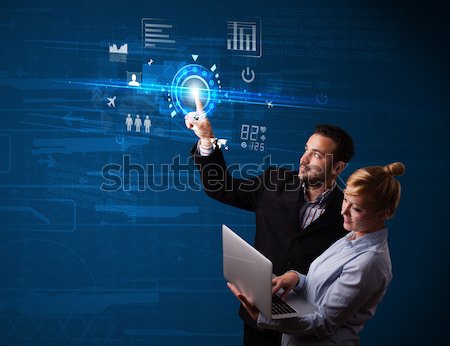 Young business couple touching future web technology buttons and Stock photo © ra2studio