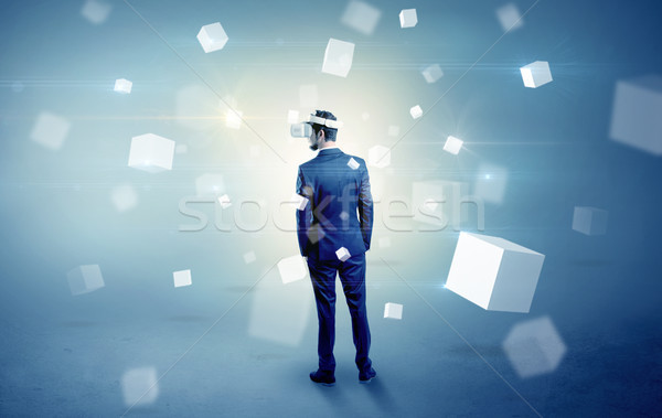 Businessman with vr goggle and falling cubes Stock photo © ra2studio