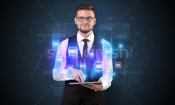 Mailing concept with businessman and tablet Stock photo © ra2studio