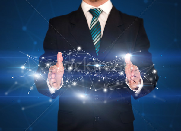 Businessman holding network connections  Stock photo © ra2studio