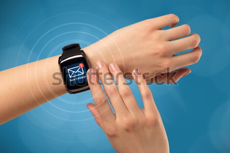 Close up female hand with balck smartwatch screen Stock photo © ra2studio