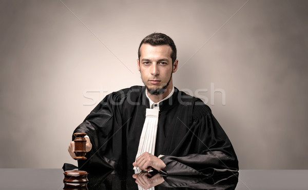 Oldscool young judge in gown Stock photo © ra2studio