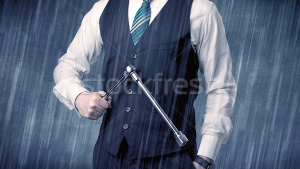 Employer standing with tool on his hand Stock photo © ra2studio