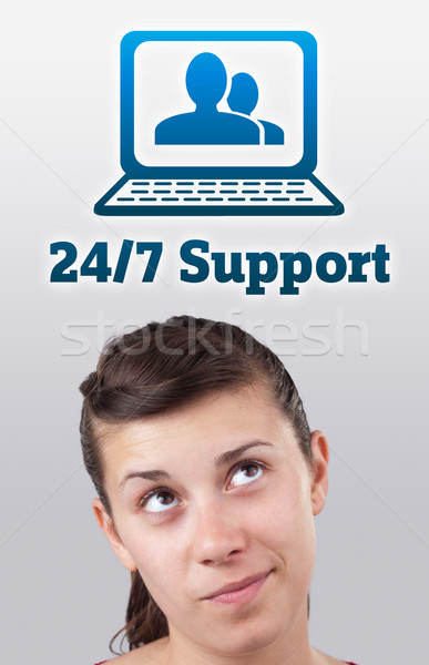 Young girl looking at support contact type of icons and signs Stock photo © ra2studio