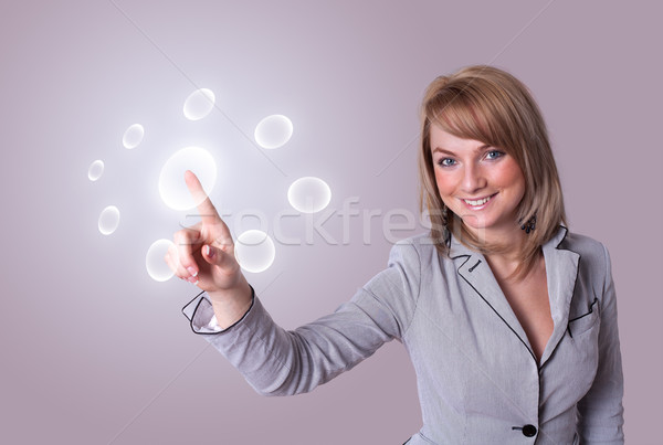woman pressing digital buttons Stock photo © ra2studio