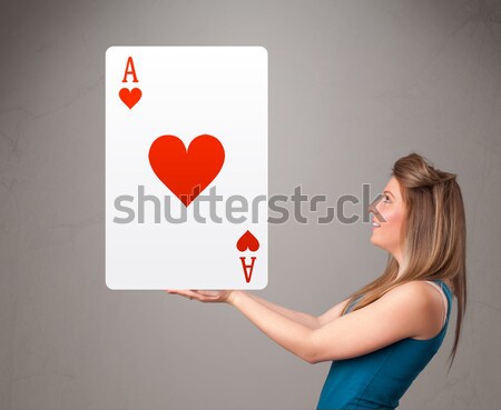 Beautifu woman holding a red heart ace Stock photo © ra2studio