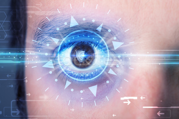 Cyber man with technolgy eye looking into blue iris Stock photo © ra2studio