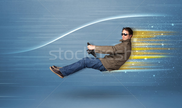 Jonge man rijden denkbeeldig snel auto wazig Stockfoto © ra2studio