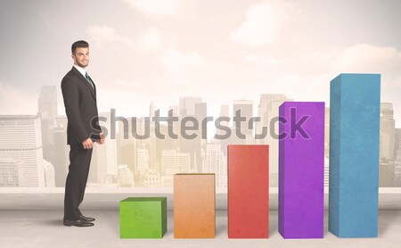 Business person climbing up on colourful chart pillars concept Stock photo © ra2studio