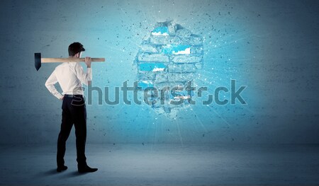 Business man hitting brick wall with huge hammer Stock photo © ra2studio