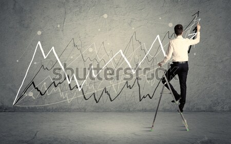 Stock photo: Man on ladder drawing lines