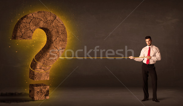 Geschäftsmann Ziehen groß solide Fragezeichen Stein Stock foto © ra2studio