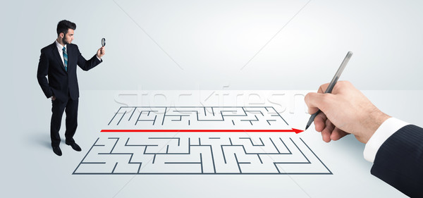 Om de afaceri uita mână desen soluţie labirint Imagine de stoc © ra2studio