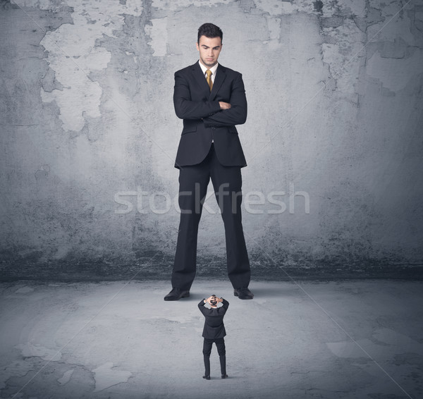 Big business bully looking at small coworker Stock photo © ra2studio