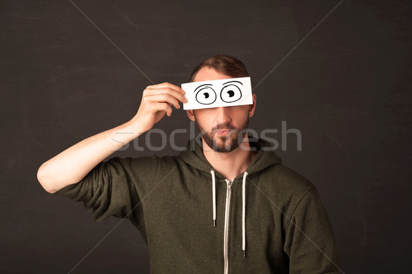 Funny man looking with hand drawn paper eyes Stock photo © ra2studio