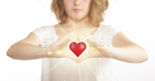 Hands creating a form with shining heart Stock photo © ra2studio