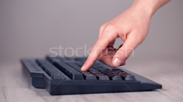 Close up of hand pressing keyboard buttons Stock photo © ra2studio