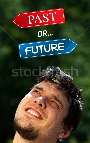 Young head looking at positive negative signs Stock photo © ra2studio