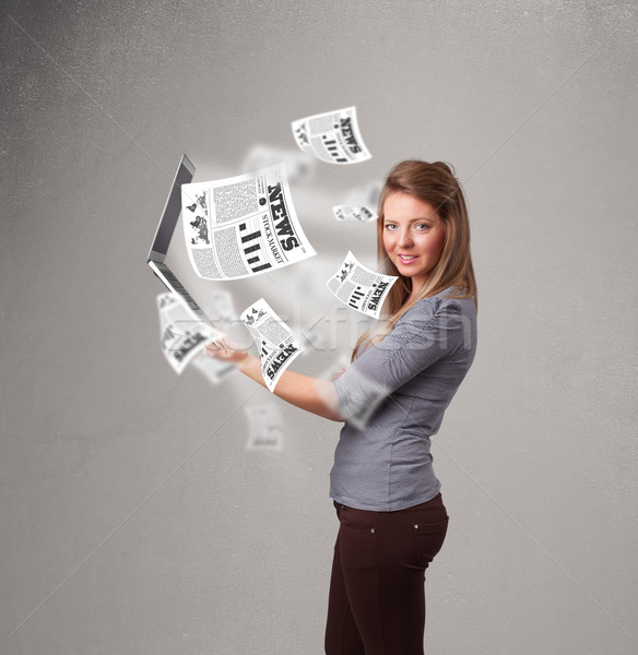 Casual pretty young woman holdin notebook and reading the explosive news Stock photo © ra2studio