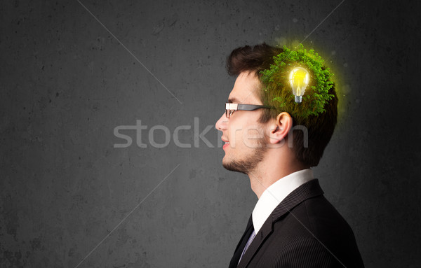 Young mind thinking of green eco energy with lightbulb Stock photo © ra2studio