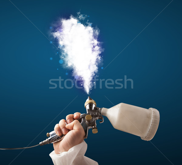 Painter with airbrush gun and white magical smoke  Stock photo © ra2studio