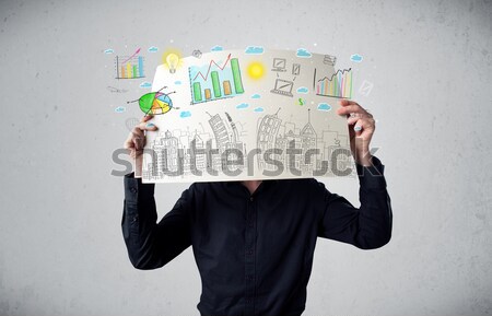 Businessman holding a paper with charts and cityscape in front o Stock photo © ra2studio