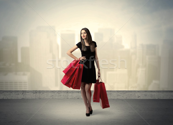 City woman standing with shopping bags Stock photo © ra2studio