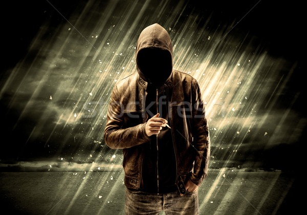 Dangerous criminal standing with cigarette Stock photo © ra2studio