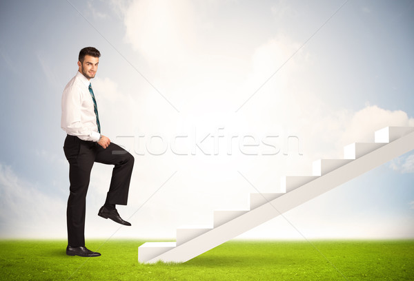 Business person climbing up on white staircase in nature Stock photo © ra2studio