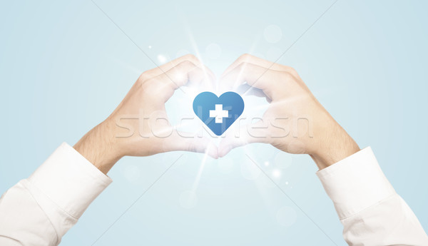 Ręce formularza serca niebieski krzyż Zdjęcia stock © ra2studio