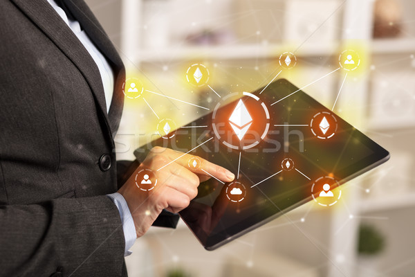 Business woman using tablet with bitcoin link network and online concept Stock photo © ra2studio