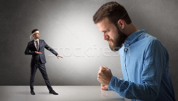 Giant man yelling at a small karate man Stock photo © ra2studio