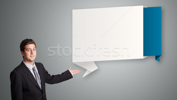 attractive man presenting modern origami copy space Stock photo © ra2studio